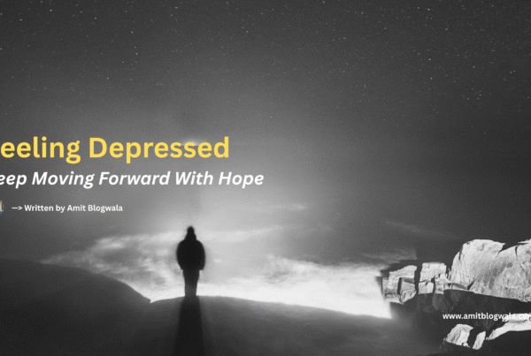 A person stands alone at the edge of a rocky cliff, facing a vast, misty sea under a starry night sky. Text overlay reads: “Feeling Depressed – Keep Moving Forward With Hope. Written by Amit Blogwala.”
