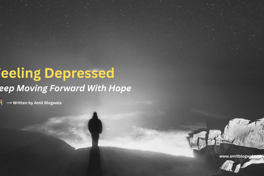 A person stands alone at the edge of a rocky cliff, facing a vast, misty sea under a starry night sky. Text overlay reads: “Feeling Depressed – Keep Moving Forward With Hope. Written by Amit Blogwala.”